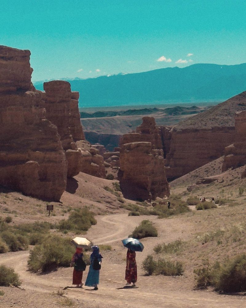 Charyn canyon with three umbrellas